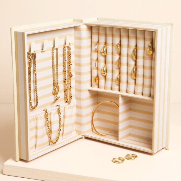 Novel “book of treasures” linen jewellery case in cream - Image 2